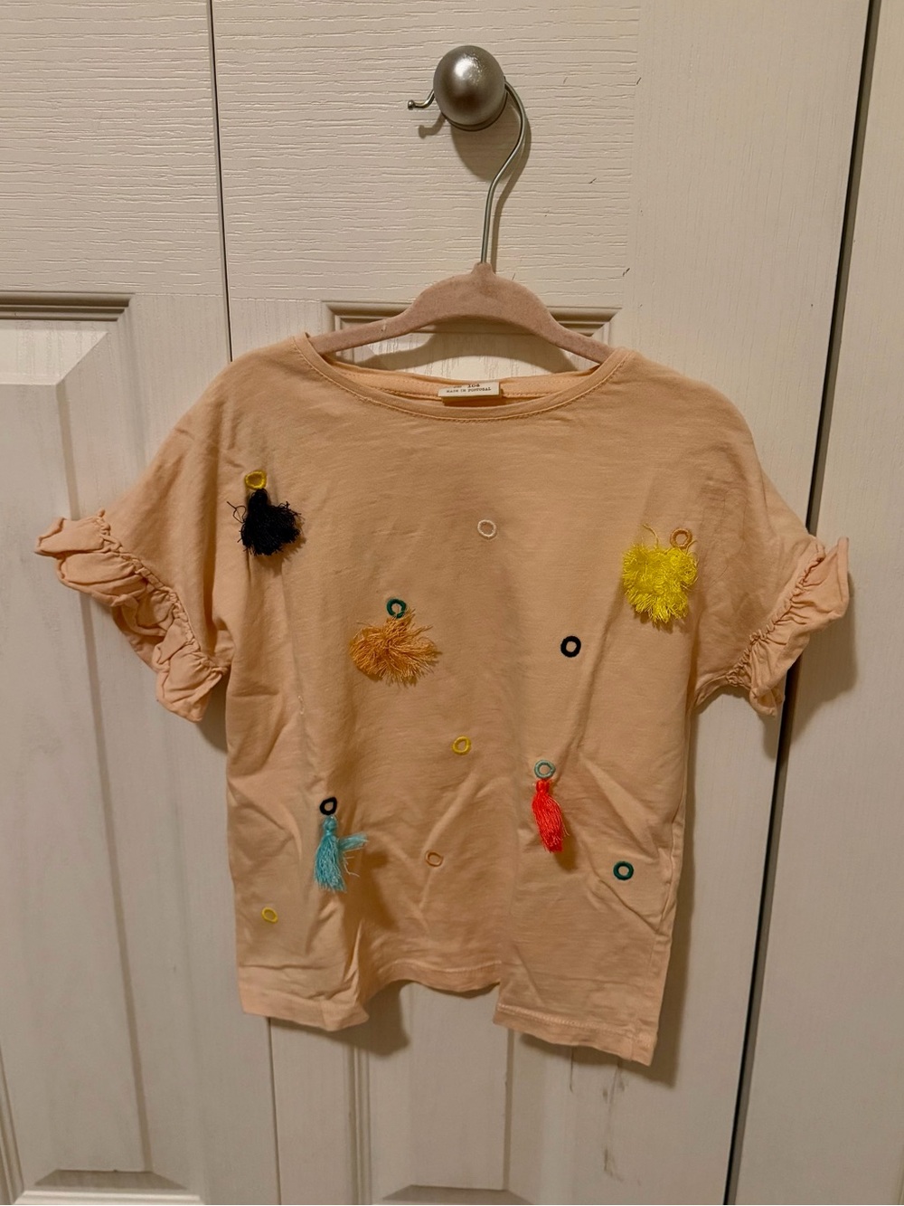 Zara Peach Short-Sleeve Tee with Multicolor Pom & Tassel Accents